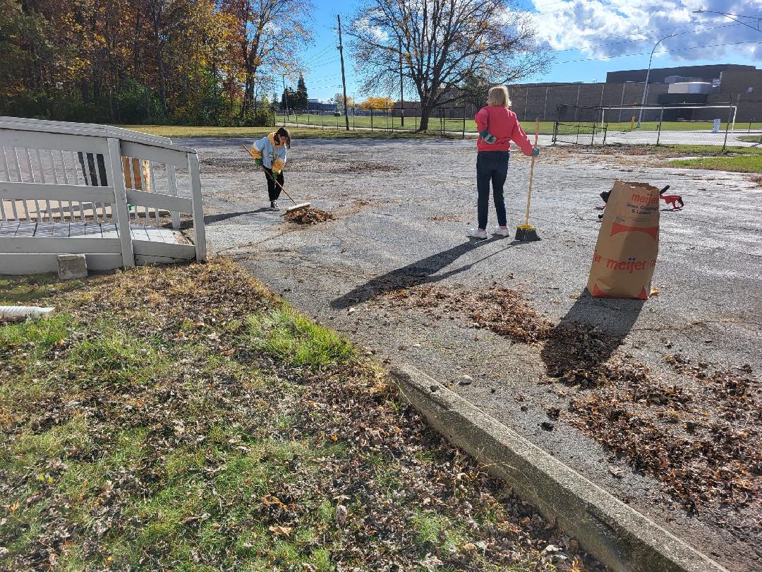 Scouts helping clean the backyard